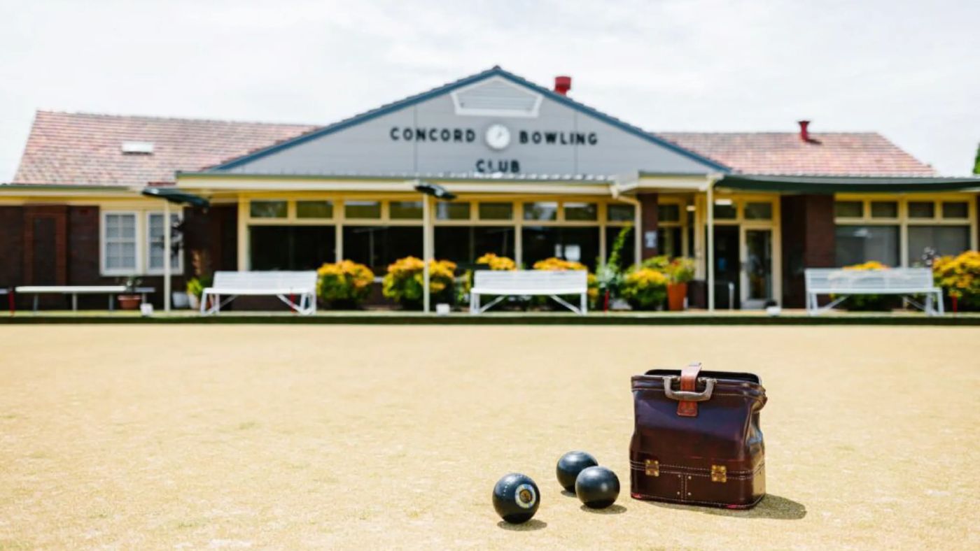 Concord Bowling Club clubhouse with bowls on the green