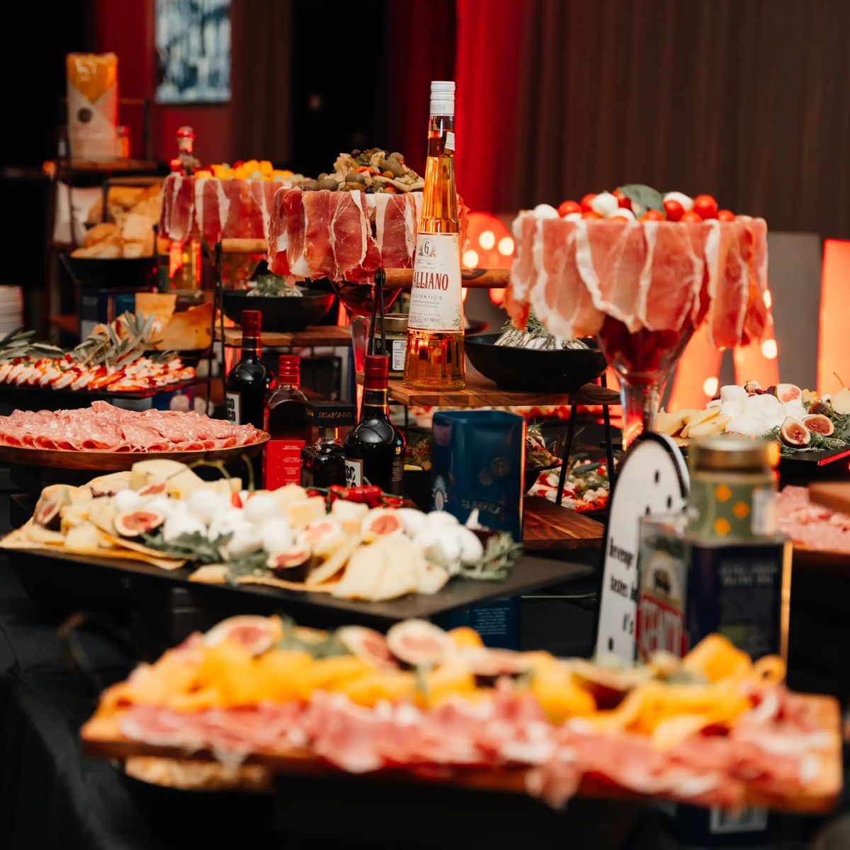 A grazing table of cured meats, cheese and fruit
