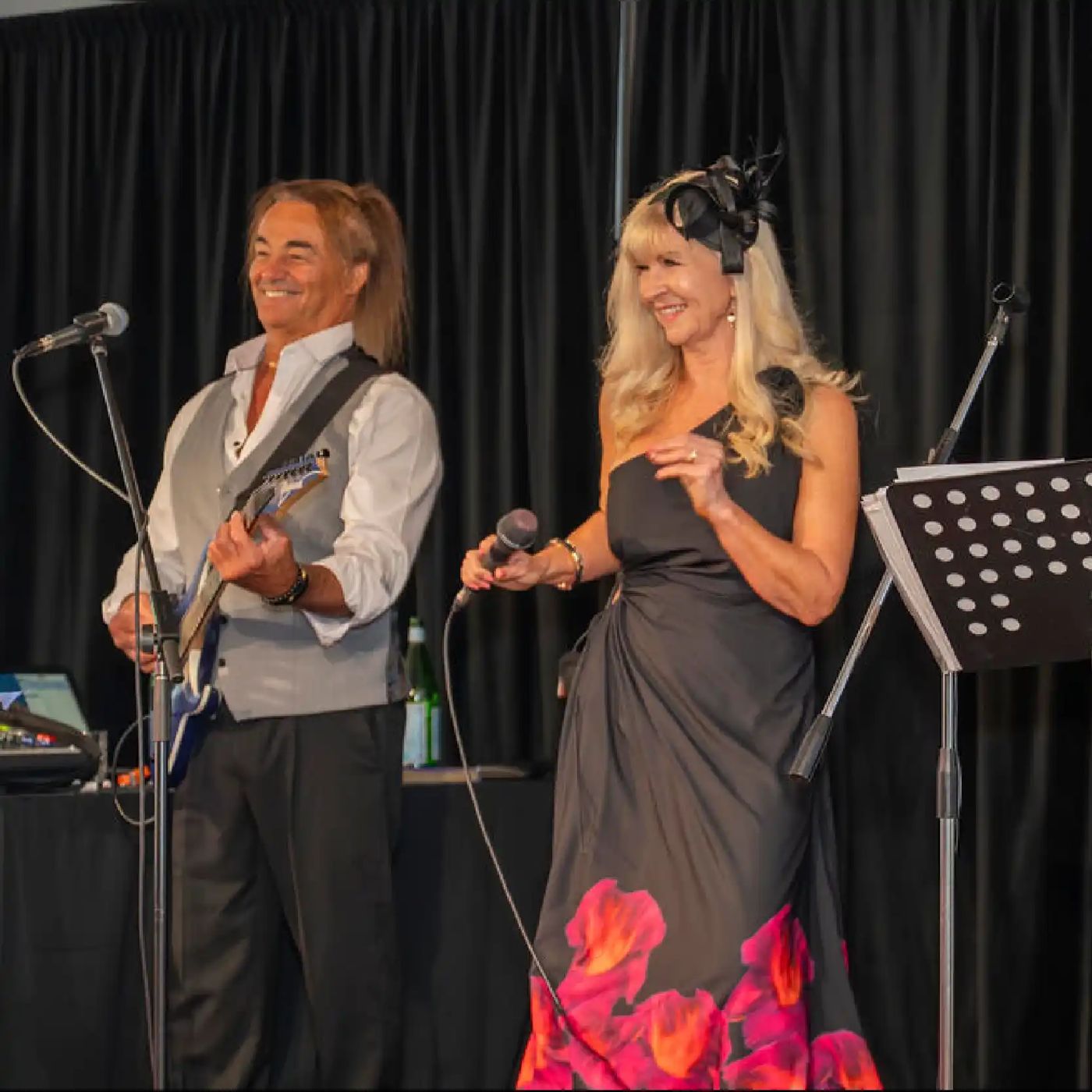 A guitarist and singer performing a duet