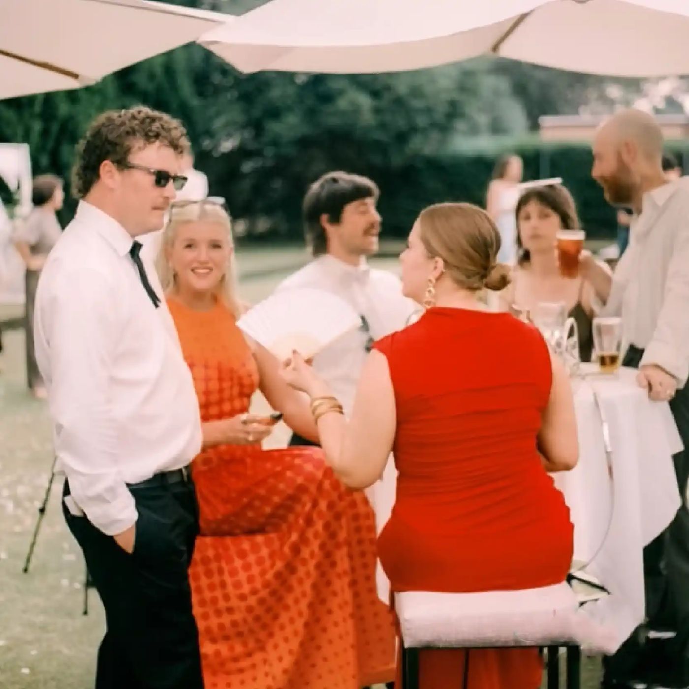 Wedding guests in summer outfits on the Concord Bowlo lawn